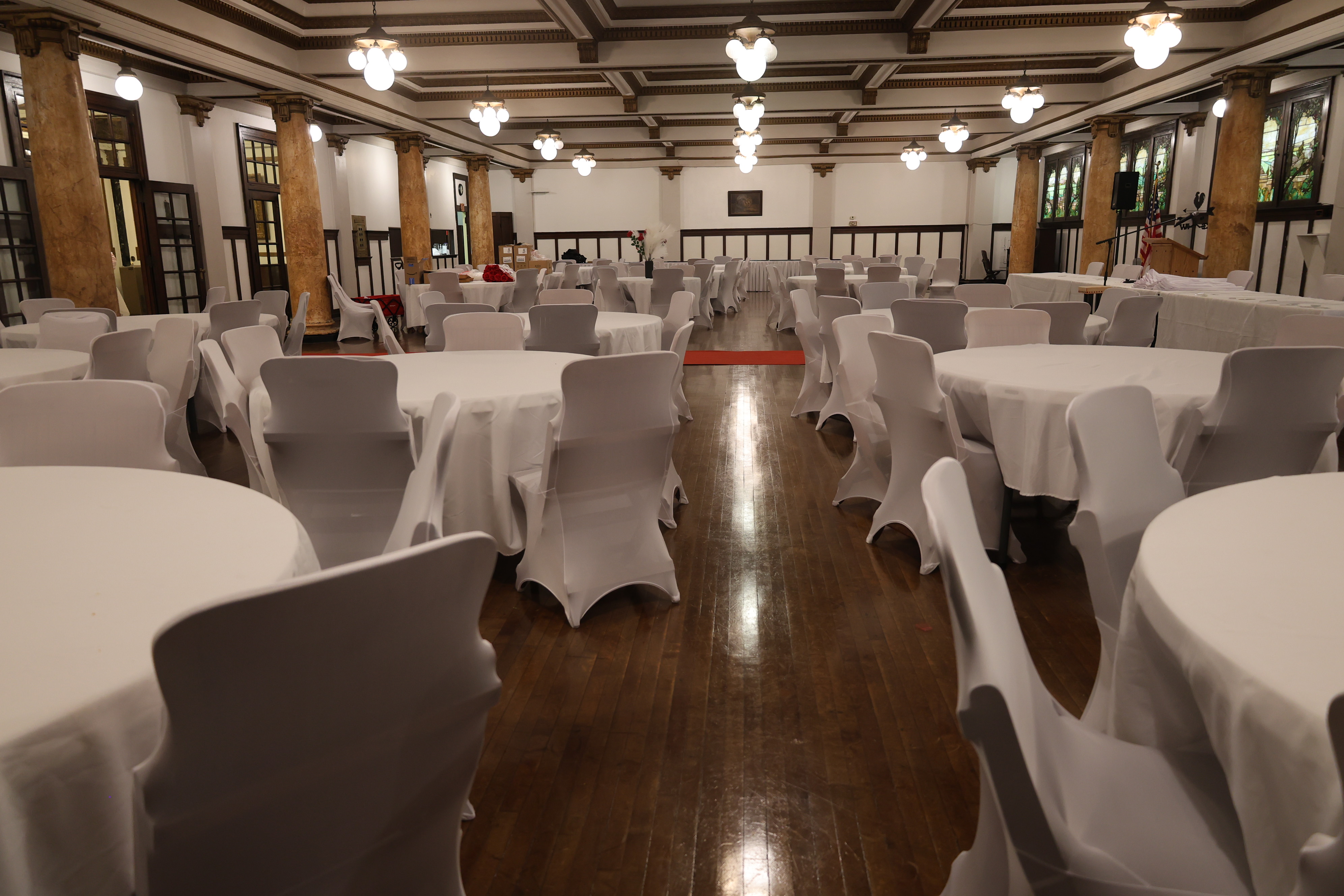 Wide view of the Tiffany Ballroom prepared with tables for an event