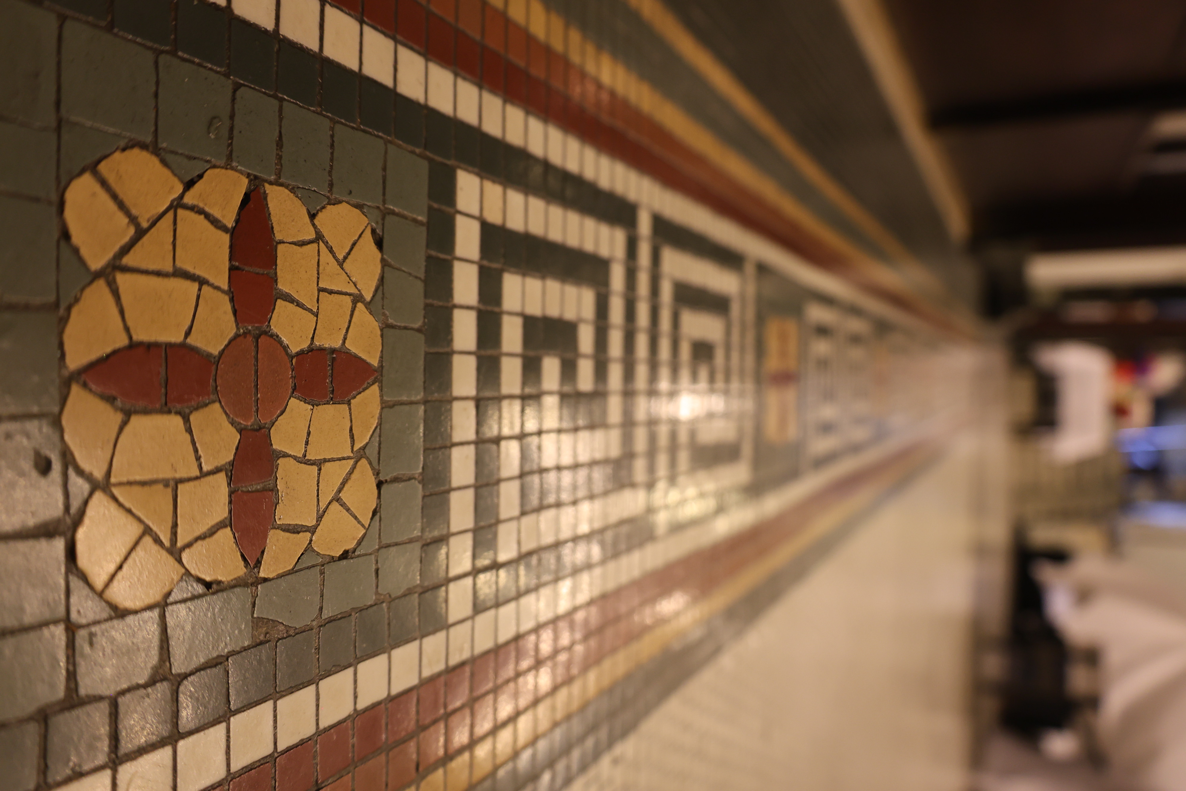 Stained glass and decorative wall detail inside the Tiffany Ballroom